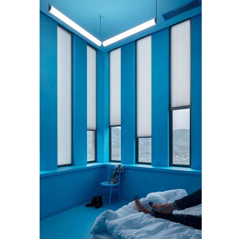 Hostel room with vertical windows